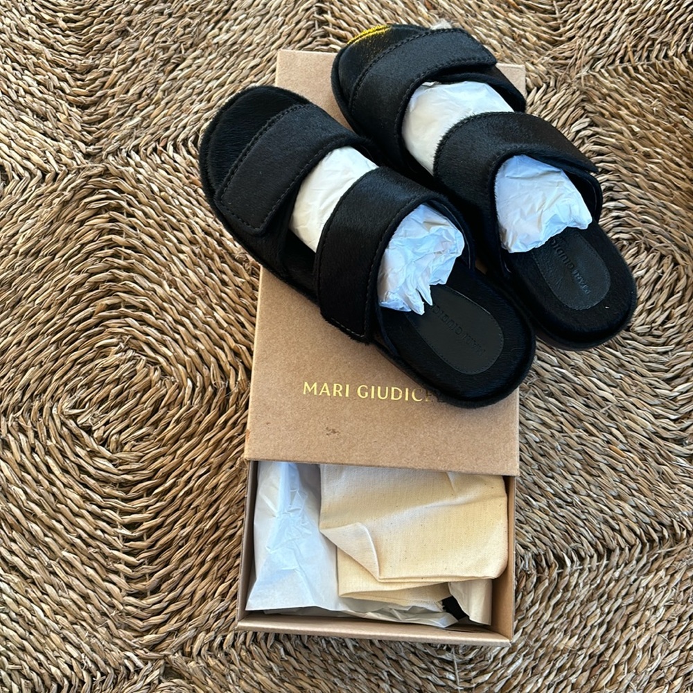 Brand new. With box and dust bag. HUGO sandals in black pony